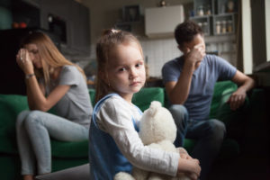 Frustrated little girl upset parents
